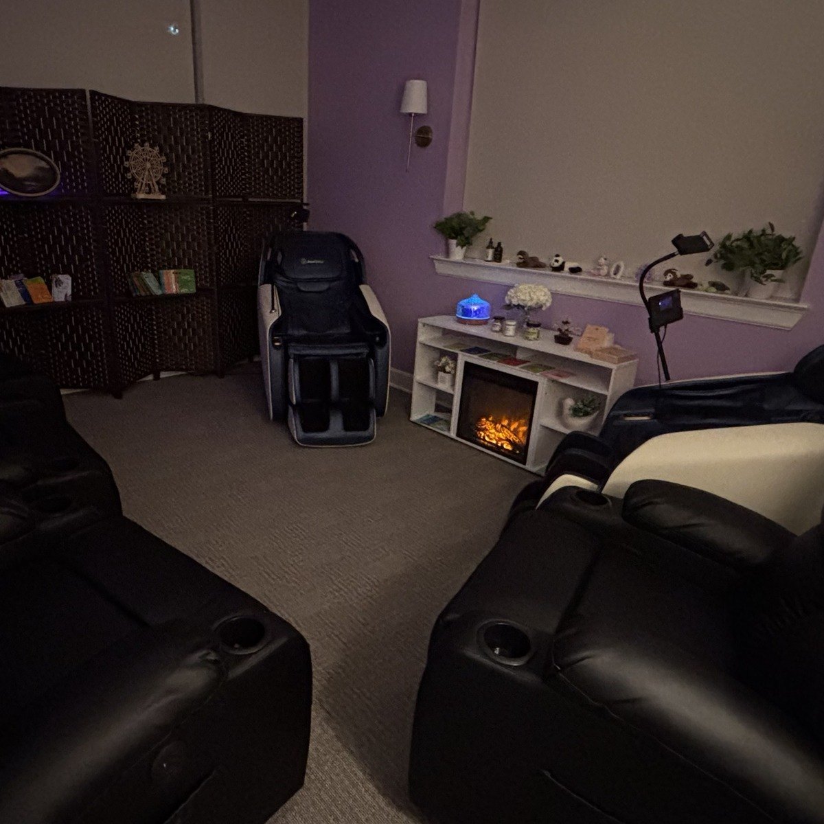 The Relaxation Room, with massage chairs and a fireplace